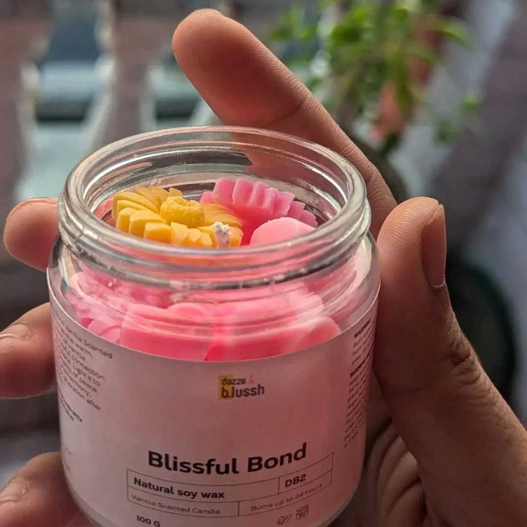 a person holding Soy Scented Candles from dazze and blussh